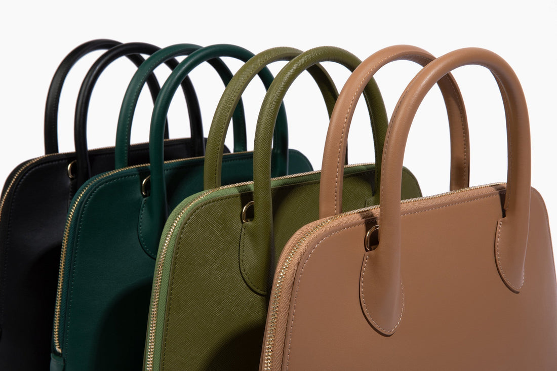 a collection of the Ms. Lady Luck handbags lined in a row