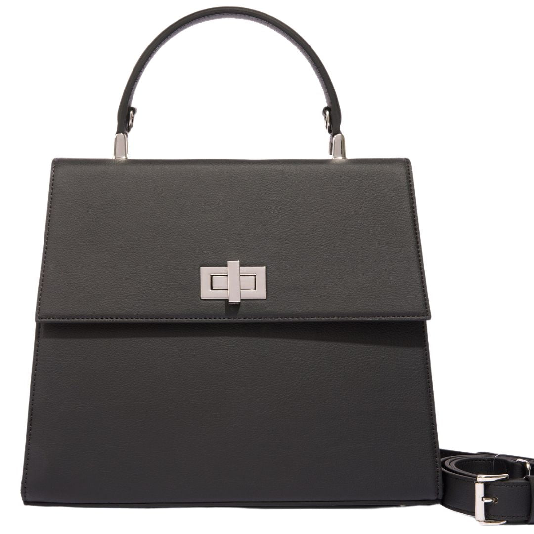 A full frontal view of a black Carter Wade handbag with an adjustable shoulder strap and silver-tone turn-lock closure