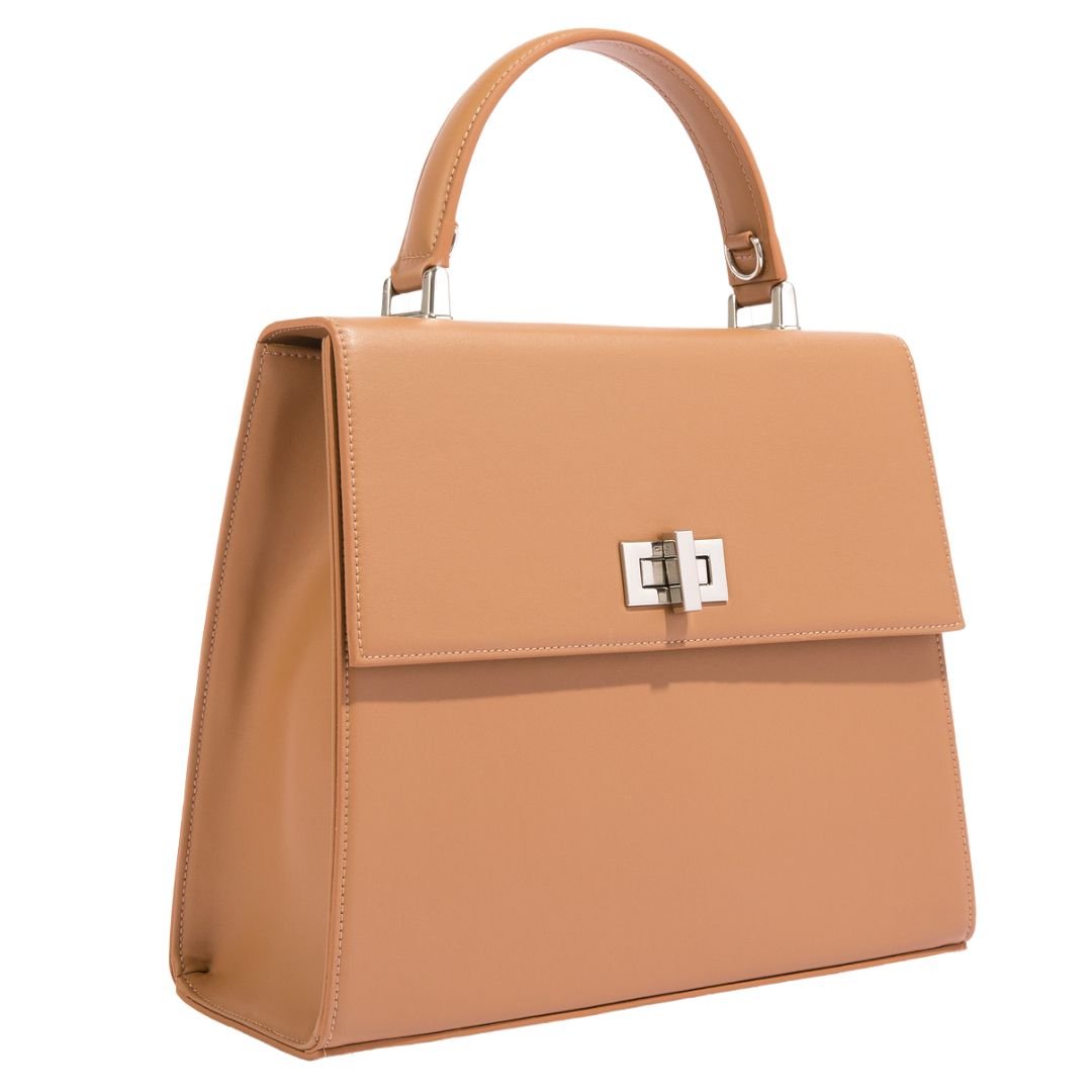 A side view of the She-EO handbag in brown grape leather, crafted from sustainable grape leather sourced from Italy, featuring a structured silhouette, silver-tone hardware, and a refined, timeless design