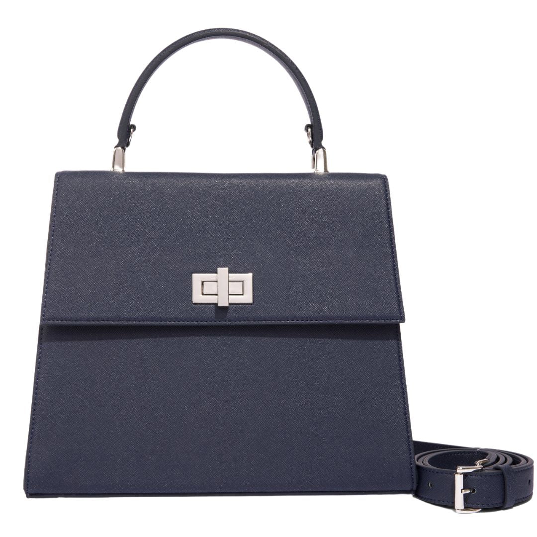 A front view of The She-EO handbag in navy blue cactus leather, showcasing its elegant turn-lock closure, structured design, and an adjustable strap for versatile styling. Handmade in NYC, featuring ethical Italian hardware
