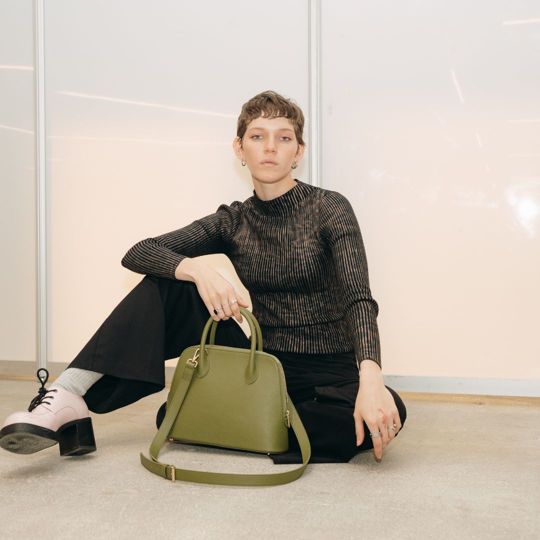 The Ms. Lady Luck handbag in a bold editorial shot, reflecting its luxurious and modern appeal.