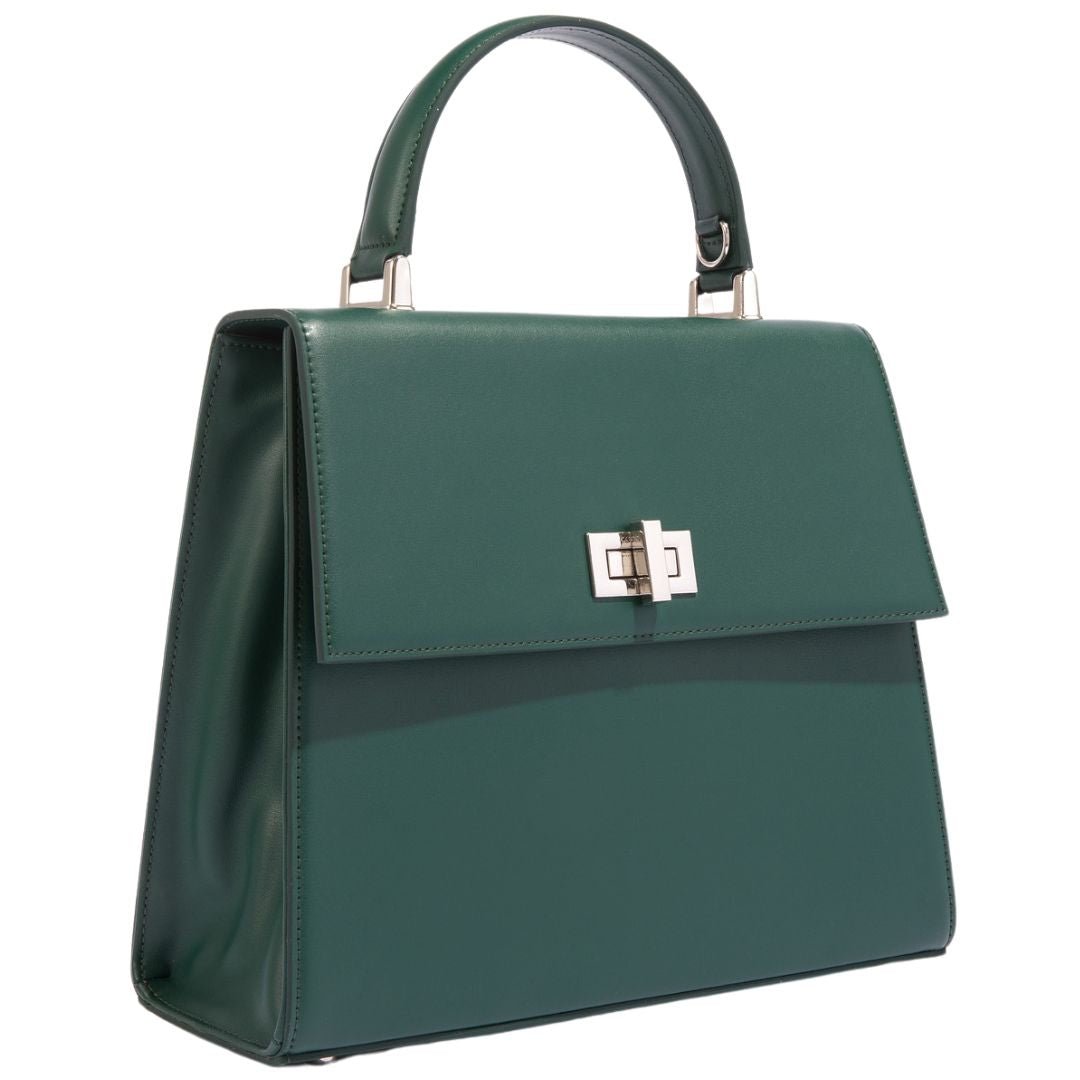 Elegant dark green vegan leather handbag with a boxy silhouette and silver hardware, designed by Carter Wade.